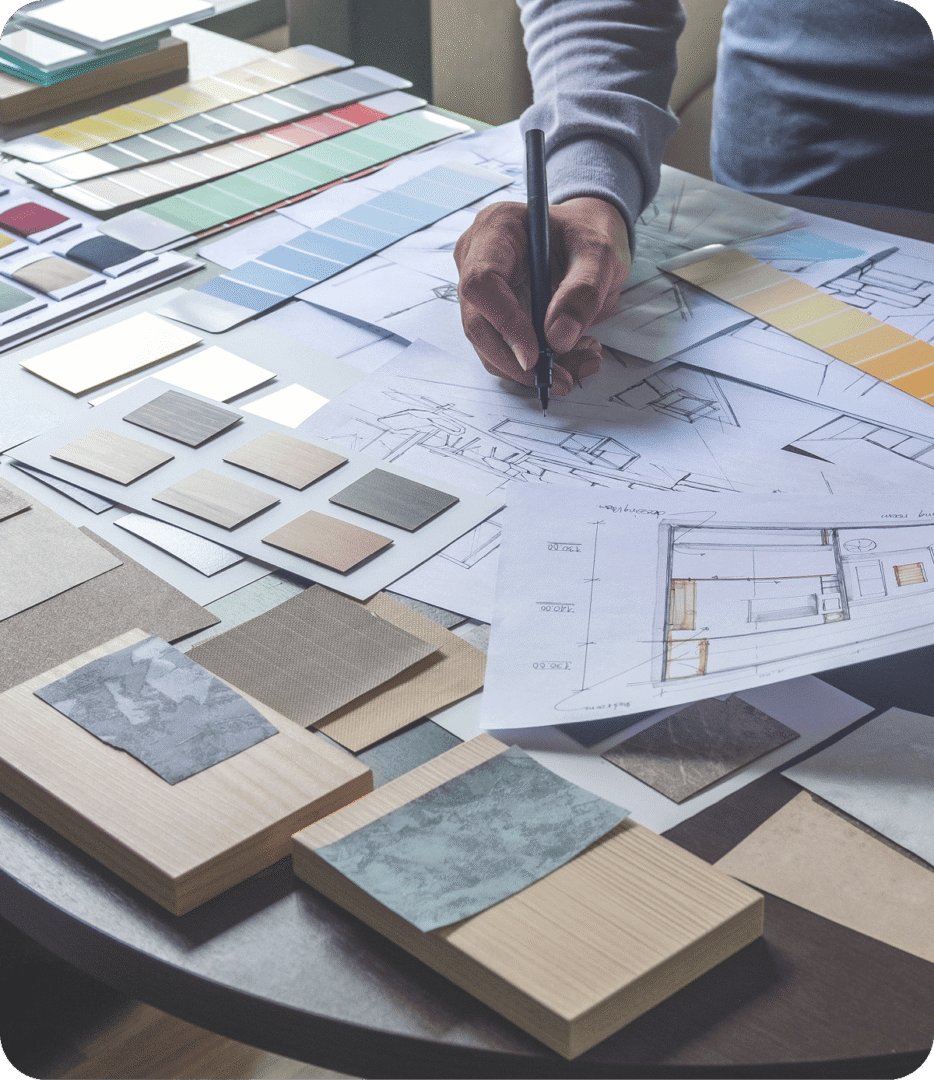 Designer sketching on architectural floor plan
