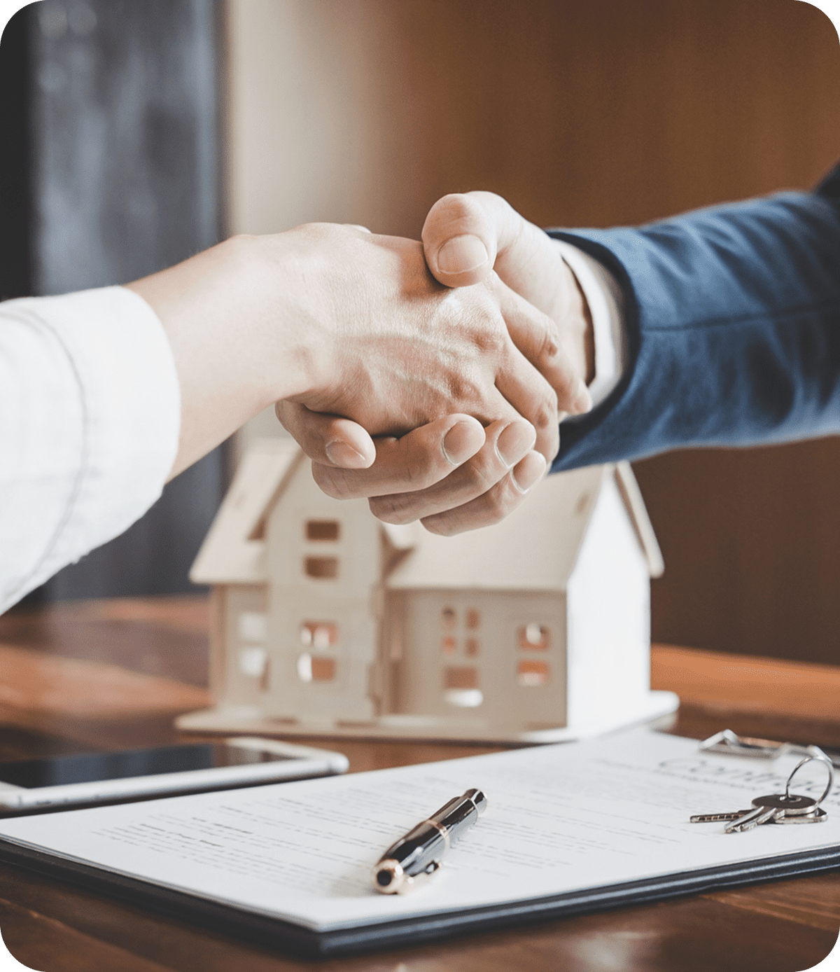 Handshake over real estate contract