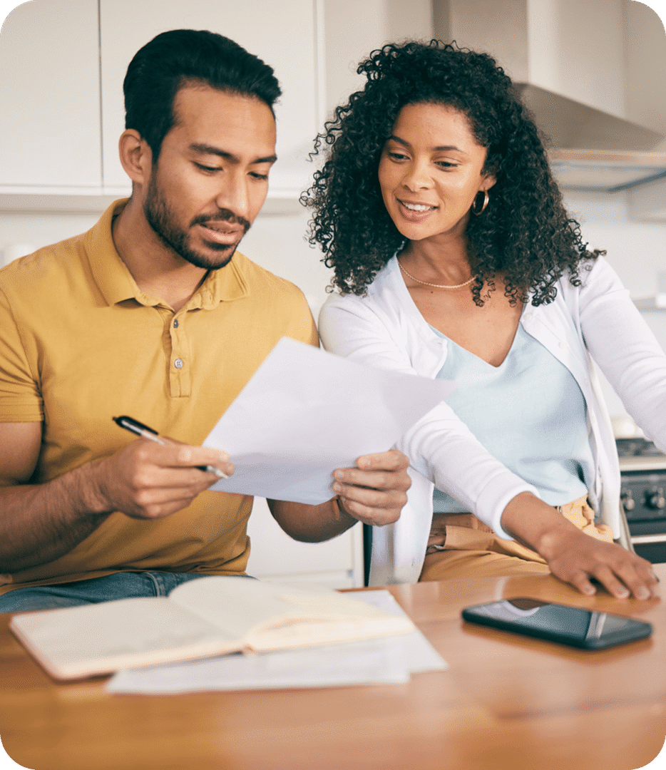 Couple reviewing documents at home