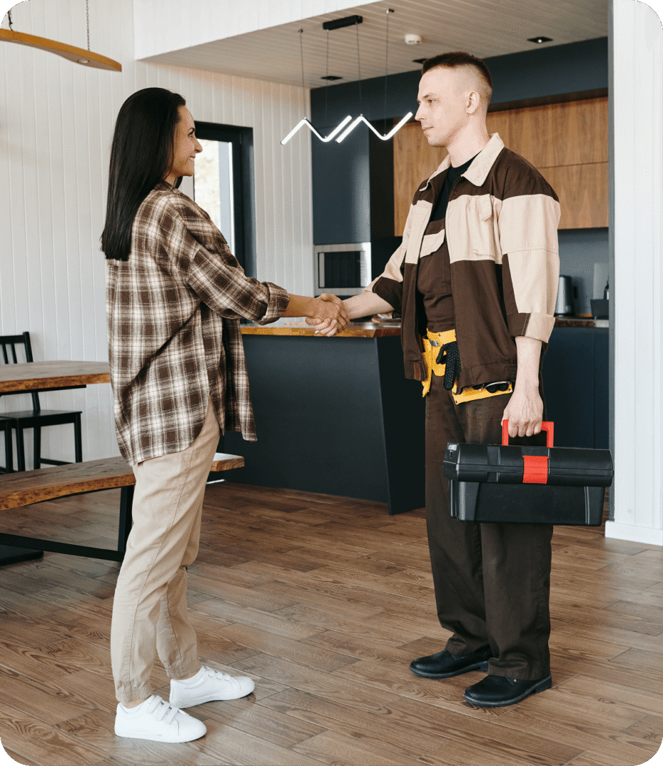 Person shaking hands with handyman